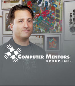 Computer mentors group with man smiling in background