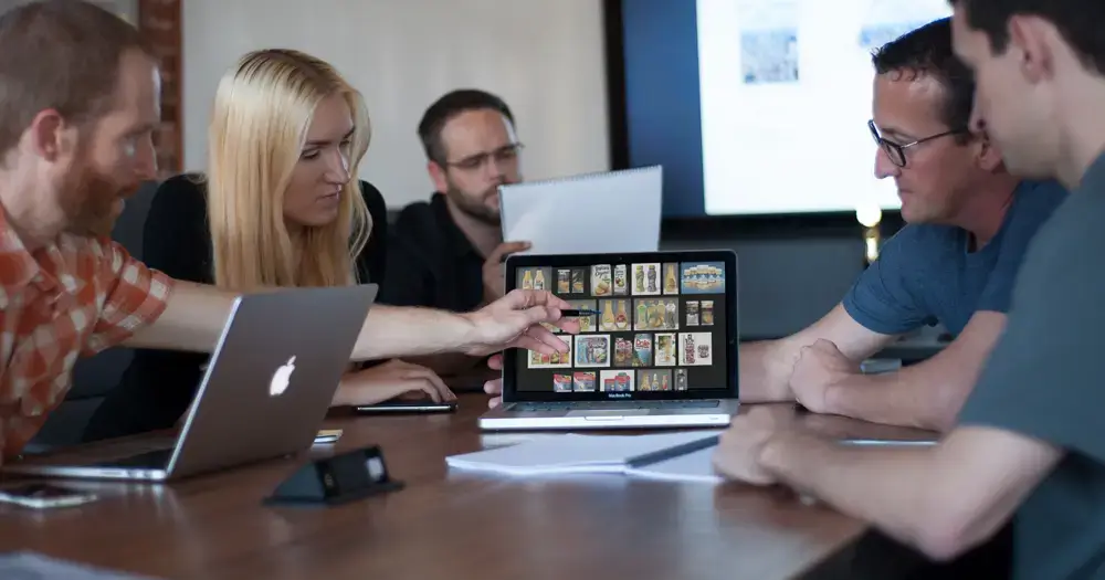 people looking at pictures on laptop