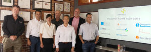 CEOs at Haneke Design in front of slideshow