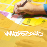 Brainstorming blog topics using Post-It notes to create an effective digital marketing strategy