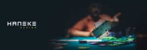 man playing poker with haneke logo