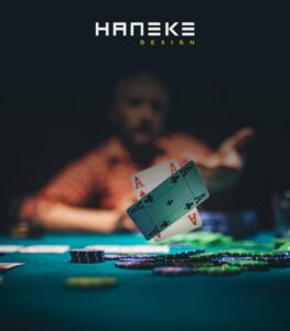 image of man flipping cards at poker table