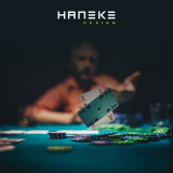 man playing poker with haneke logo