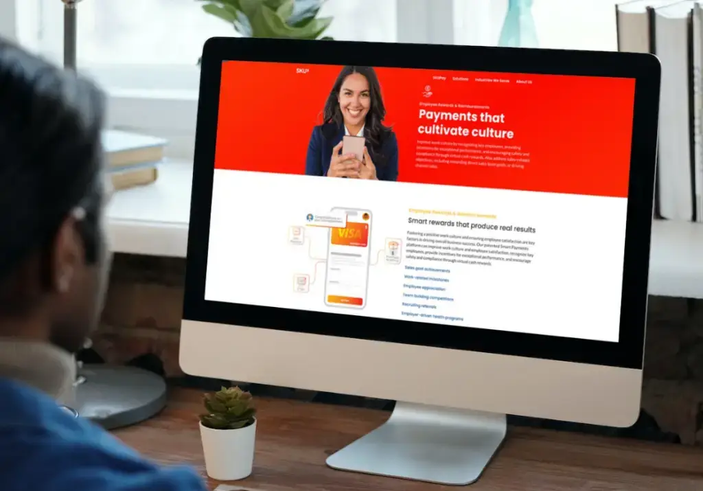 person looking at SKUx site on computer